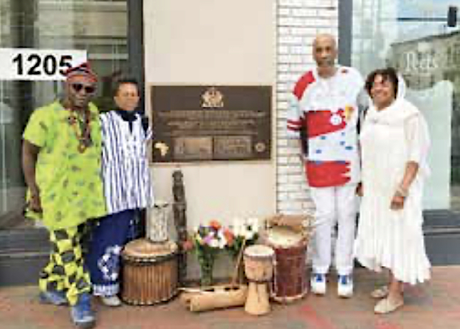 Joseph Ngwa, Afua Mona Cheri Pollard, Lafayette Barnes and Eurica Huggins pose in front of the Freedom Crossing commemorative plaque. (Courtesy photo)