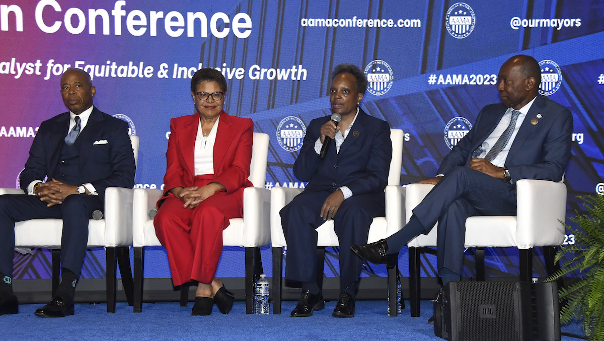 Chicago Mayor Lori Lightfoot (second from right) makes a comment while New York City Mayor Eric Adams (left), Los Angeles Mayor Karen Bass (second from left) and Houston Mayor Sylvester Turner listen at the 9th annual Conference of the African American Mayors Association. (Robert R. Roberts/The Washington Informer)
