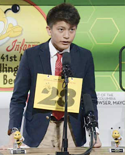 Jerald Campana, an 8th grader at St. Albans School, spells his last word that brought victory in the 2023 DC Citywide Spelling Bee. (Roy Lewis/The Washington Informer)