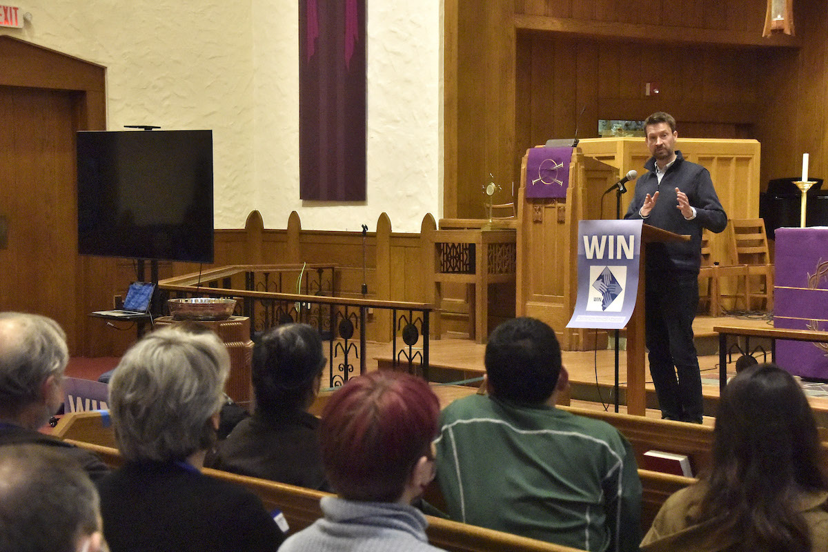 D.C. Council member Charles Allen speaks to a crowd of nearly 100 people at a budget action event hosted by the Washington Interfaith Network on March 25. (Robert R. Roberts/The Washington Informer)
