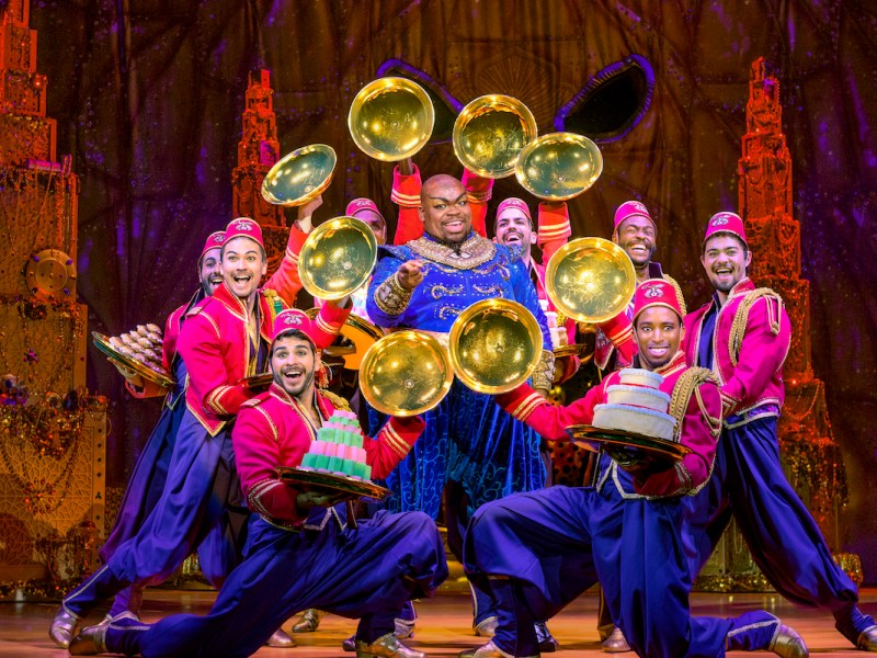 Marcus M. Martin is the Genie surrounded by the company in Disney's "Aladdin" at the National Theatre until April 30. (Courtesy of Deenvan Meer)
