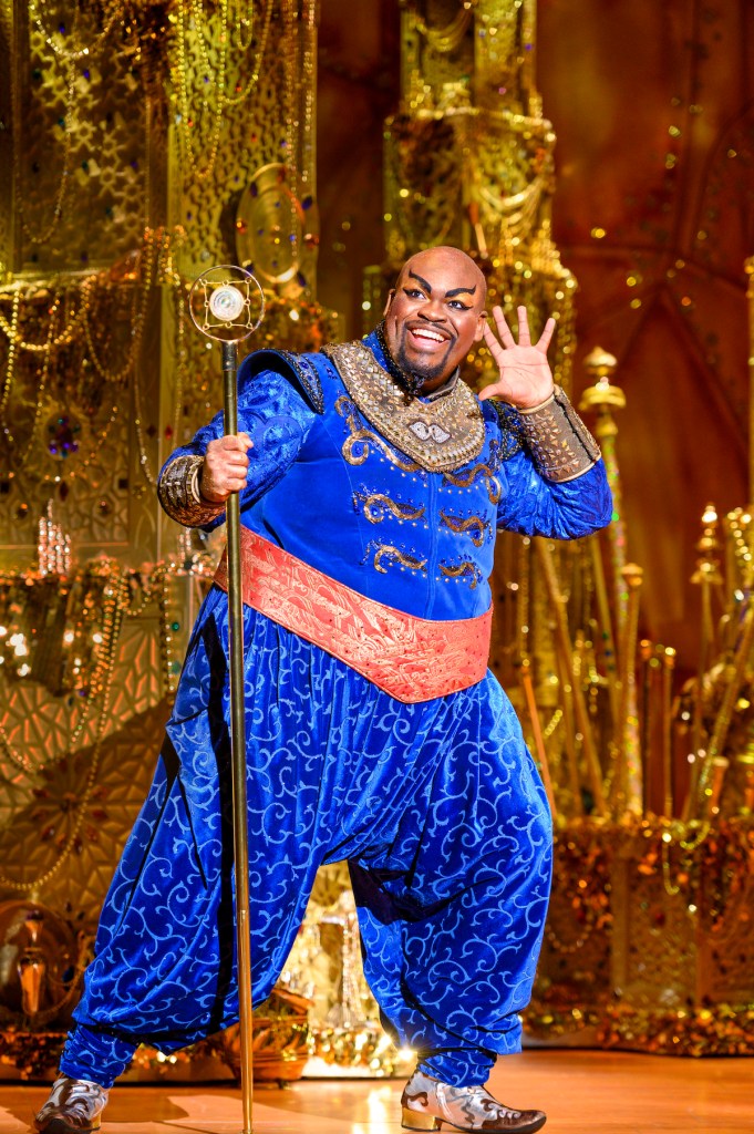 Marcus M. Martin is the Genie surrounded by the company in Disney's "Aladdin" at the National Theatre until April 30. (Courtesy of Deenvan Meer)