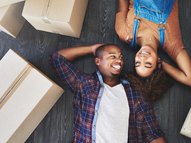 Shot of an attractive young couple moving house