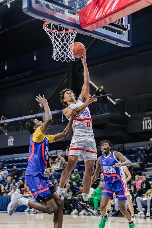 Tyler Perkins (12) scores two of his game-high 23 points to lead the Capital Stars to victory over the US Stars in 50th Annual Capital Classic. (Jonae Guest/The Washington Informer)