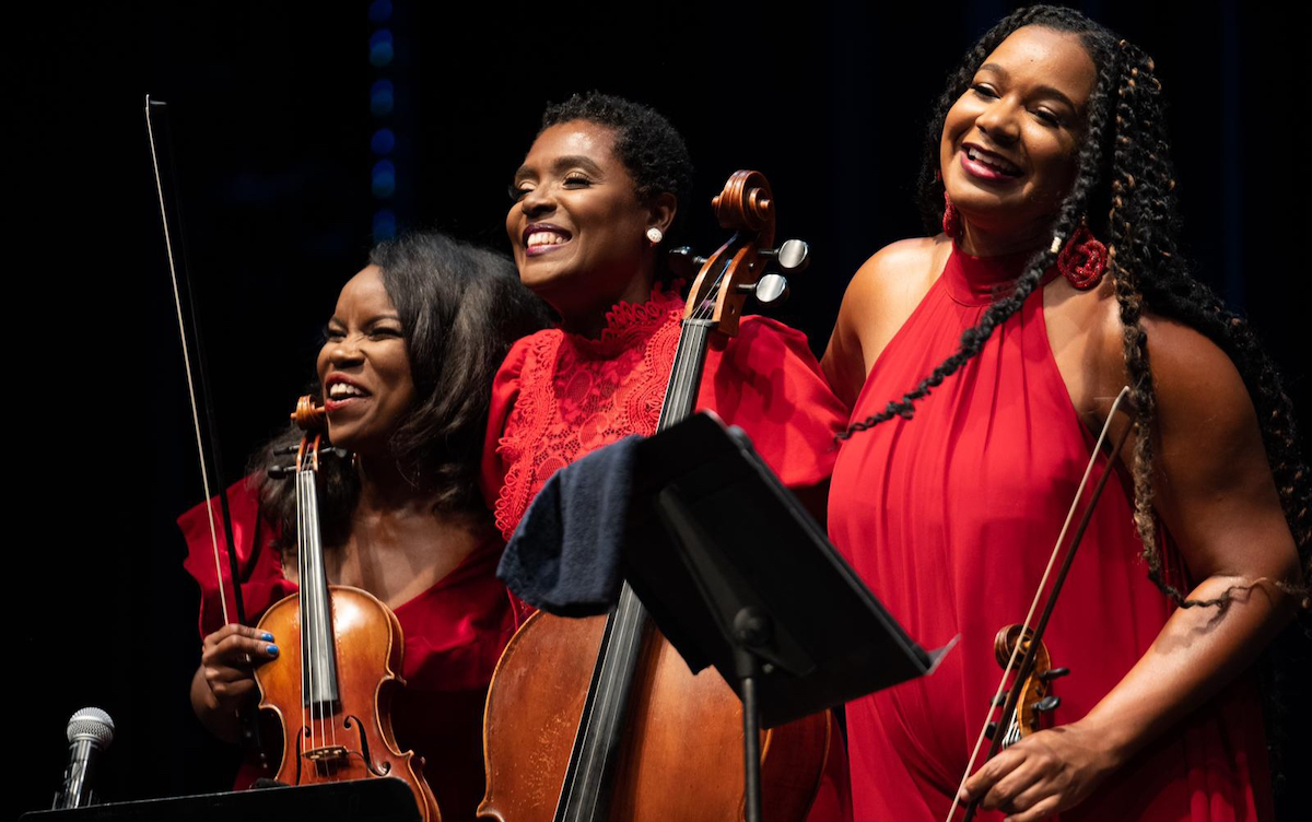 The String Queens (TSQ) are full-time schoolteachers. They will perform two shows at AMP in North Bethesda on May 12. TSQ includes (from left) violinist Kendall Isadore, cellist Élise Sharp, and violist Dawn Johnson. (Courtesy of Leroy Armstead)