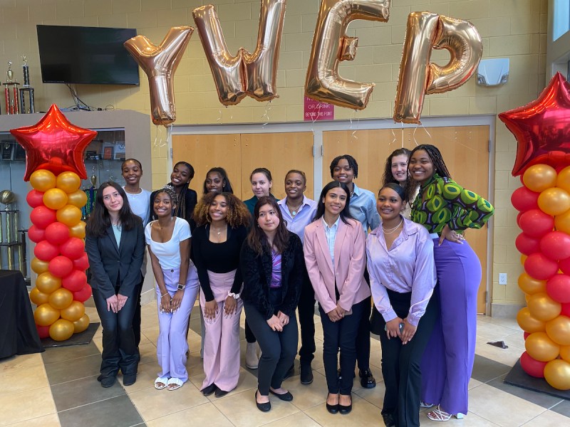Students and staff pose at the inaugural Young Women’s Entrepreneurship Program Small Business Expo on April 27 at Elizabeth Seton High School in Bladensburg, Maryland. (Micha Green/The Washington Informer)