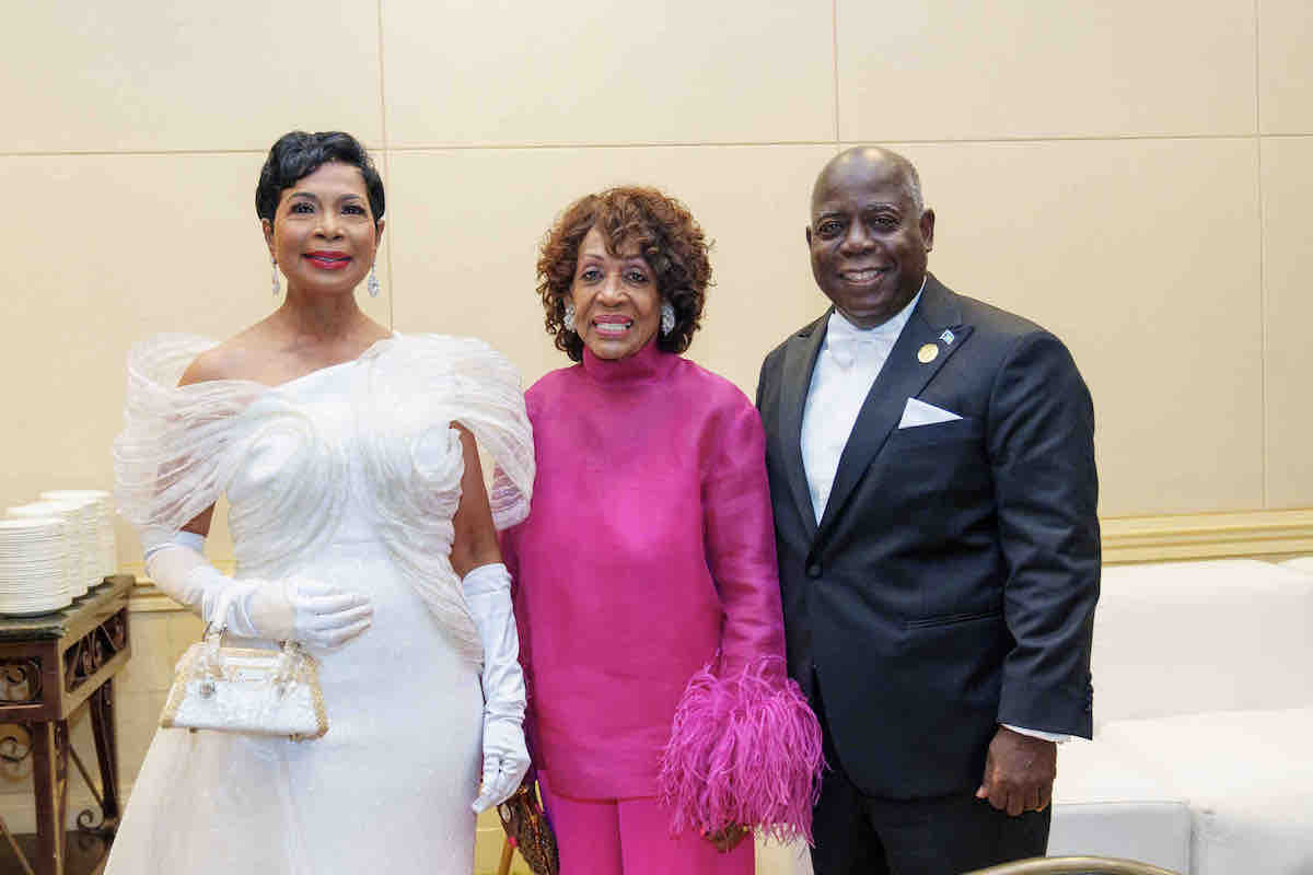 Rep. Maxine Waters poses with Bahamas Prime Minister Philip E. Davis and first lady Ann Marie Davis at the Prime Minister's Legacy Ball at the Atlantis Resort on Paradise Island on July 7. (Courtesy photo)