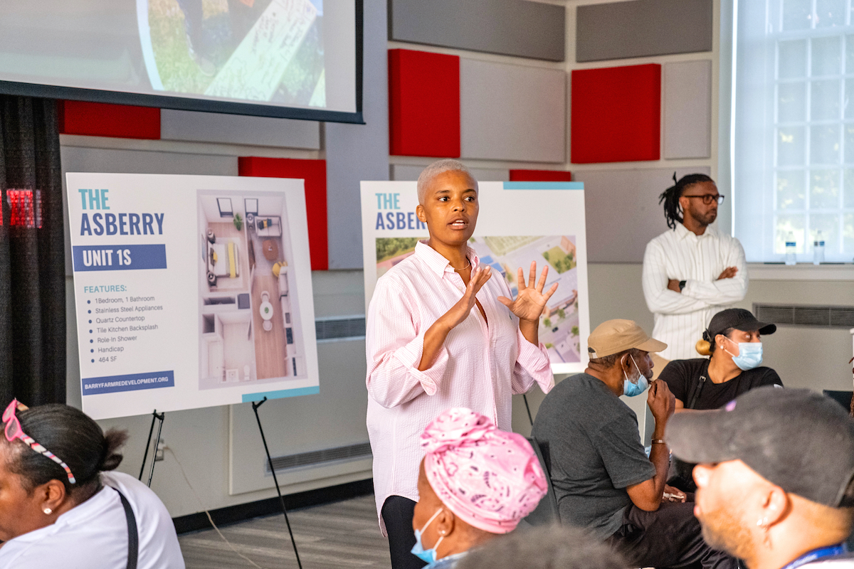 Maia Shanklin Roberts, POAH vice president of real estate development, talks to residents about Barry Farm.