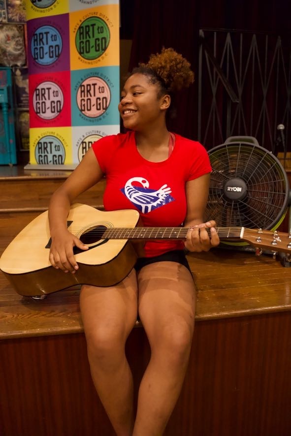 Otisha Richards performs a song she wrote during the songwriting workshop during the Summer Empowerment Camp for the Future Diamonds of Southeast Washington DC at Busboys and Poets in Anacostia, held from Aug. 14-18.
