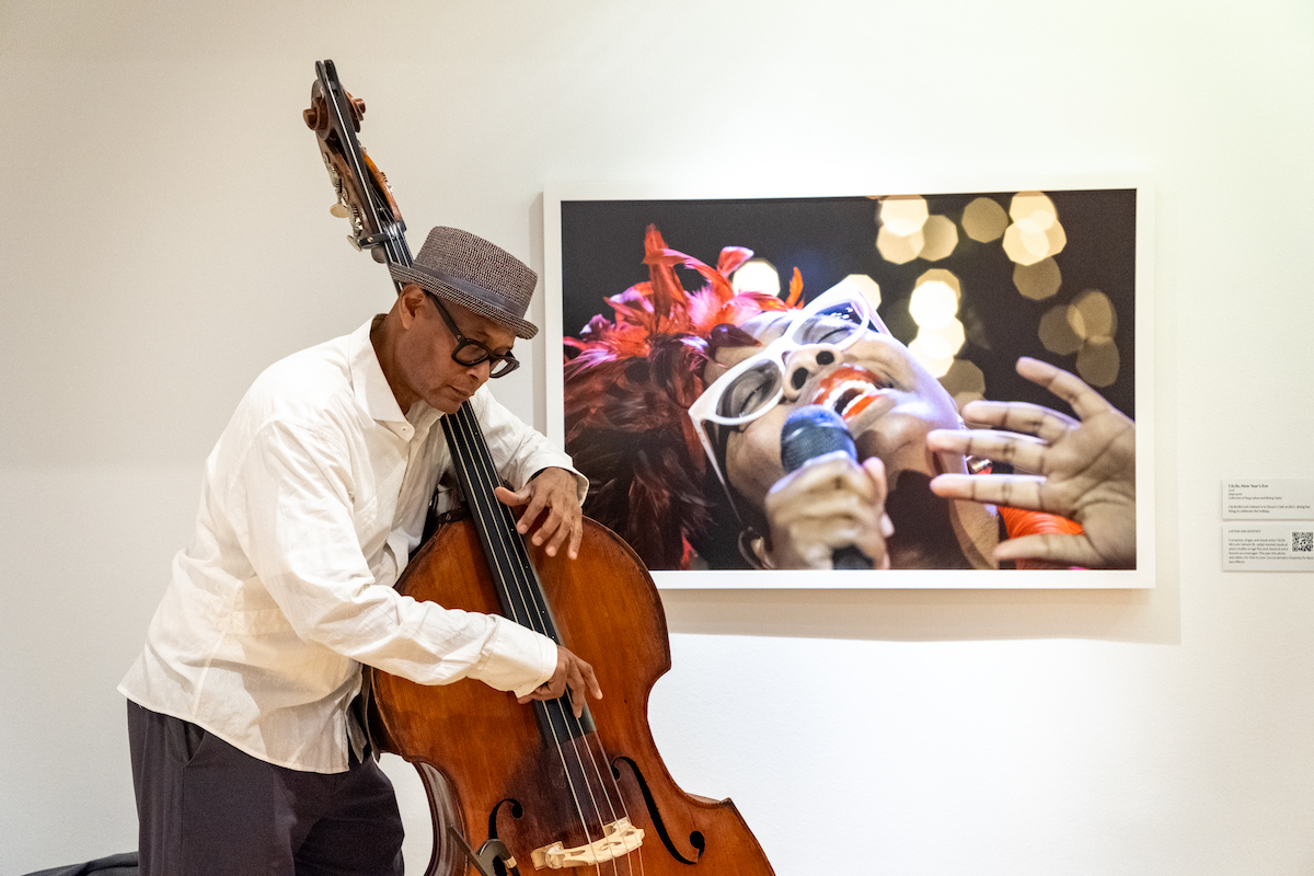 Double bass master Herman Burney performs before Frank Stewart's portrait of award-winning jazz vocalist Cécile Salvant McLorin at “Phillips After 5: All That Jazz,” a collaboration between The Phillips Collection and DC JazzFest. (Ja’Mon Jackson/The Washington Informer)
