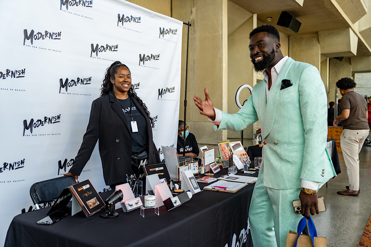 MelaninCon Chief Operating Officer Donovan Woodberry checks out the Modernish vendor booth. (Ja'Mon Jackson/The Washington Informer)