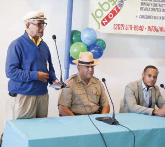 WPFW commentator Roach Brown makes a point at the Jobs Not Guns Employment Fair on Sept. 15. (Marckell Williams/The Washington Informer)