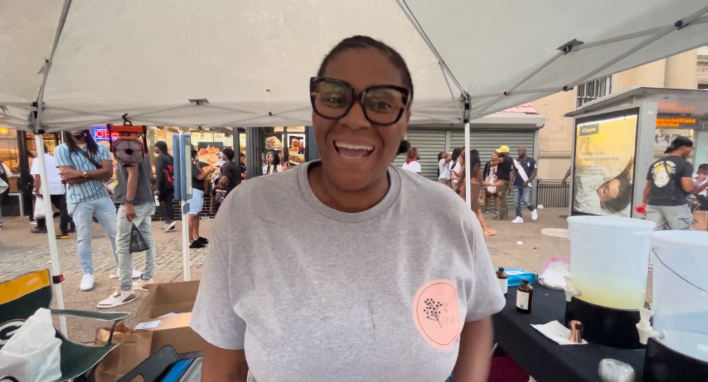 Taryn Laster Whitehead, co-owner of On the Vine Elderberry Syrup, chats about her product at the H Street Festival. (Micha Green/The Washington Informer)