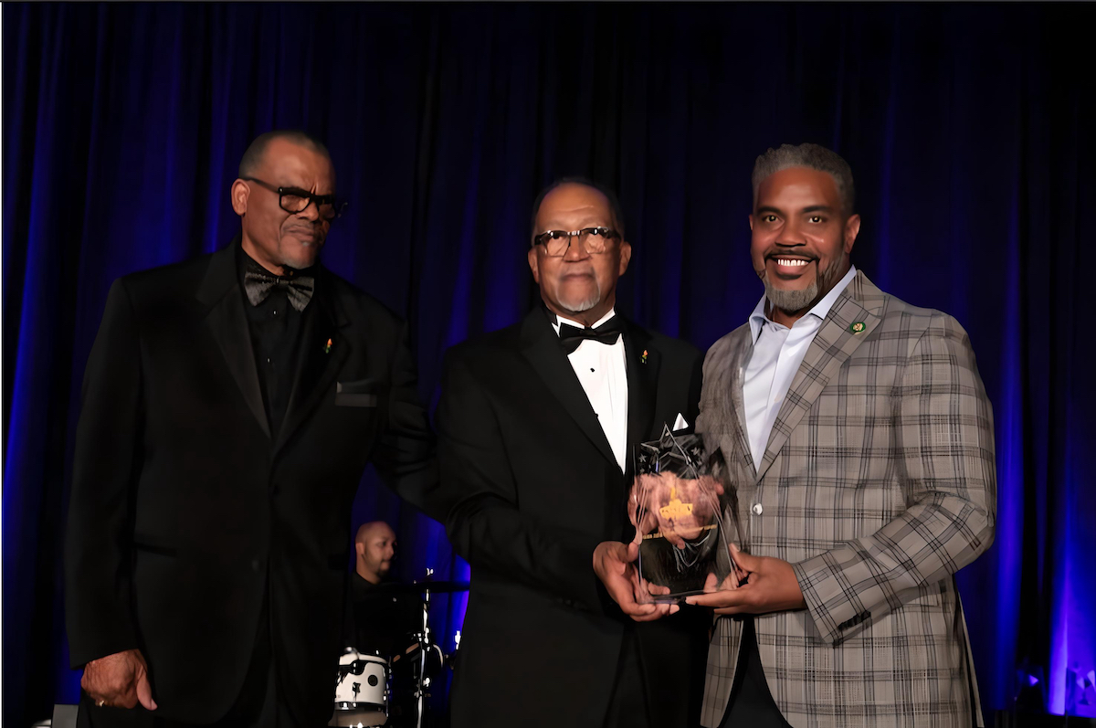 From left: NNPA Chair Bobby Henry and NNPA President and CEO Dr. Benjamin F. Chavis present an award to CBC Chair Steven Horsford (D-Nevada). (Photo by Mark Mahoney)