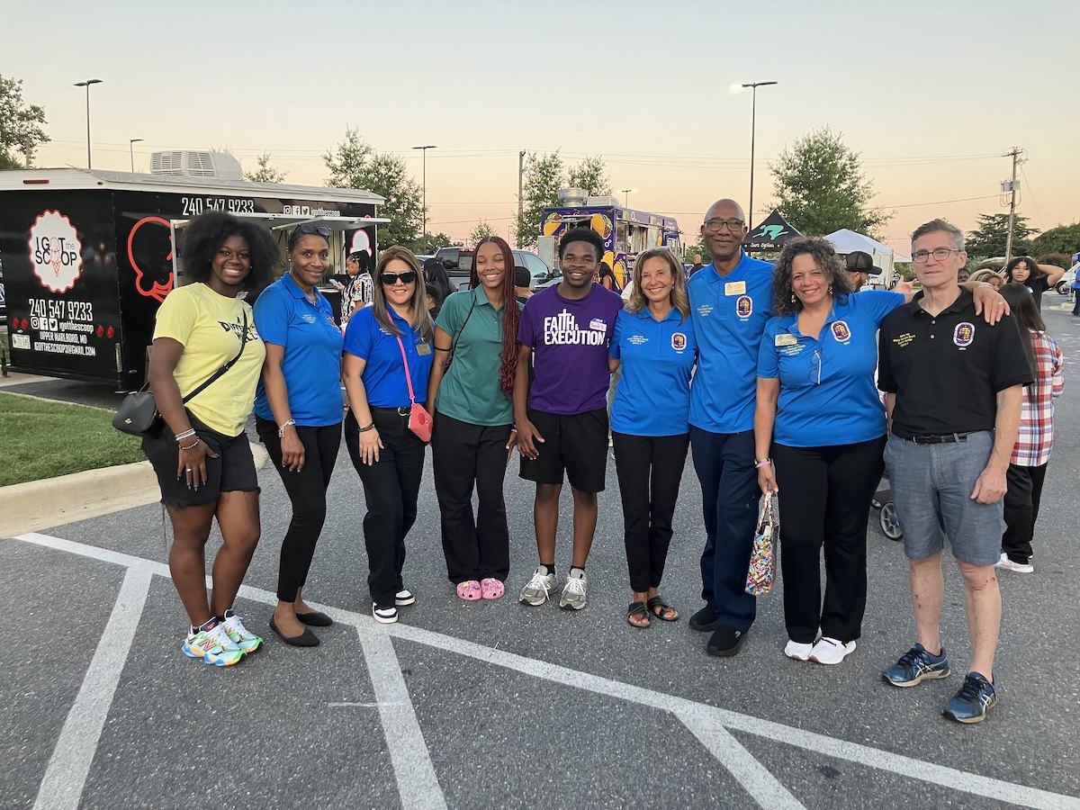 Council member Jolene Ivey (center in blue shirt) and her staff at the Back to School Fest. (Courtesy of Ivey)