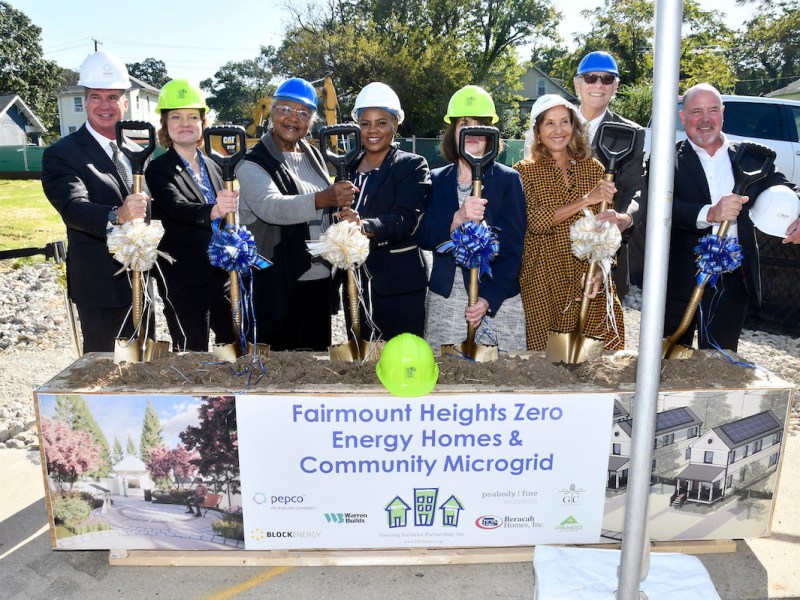 Many stakeholders are involved in the development of six zero-energy homes in Fairmount Heights that will pilot a new microgrid technology. Pictured at the Oct. 13 groundbreaking ceremony, from left: J. Tyler Anthony, Pepco president & CEO; Stephanie Prange Prostel, Housing Initiative Partners deputy director; Md. state senator Joanne C. Benson; Akiaba Stewart, mayor of Fairmount Heights; Maryann Dillon, executive director of Housing Initiative Partnership; Jolene Ivey, Prince George’s County councilmember; Paul Pinsky, director of Maryland Energy Administration; and Rob Bennett, BlockEnergy CEO. (Robert R. Roberts/The Washington Informer)