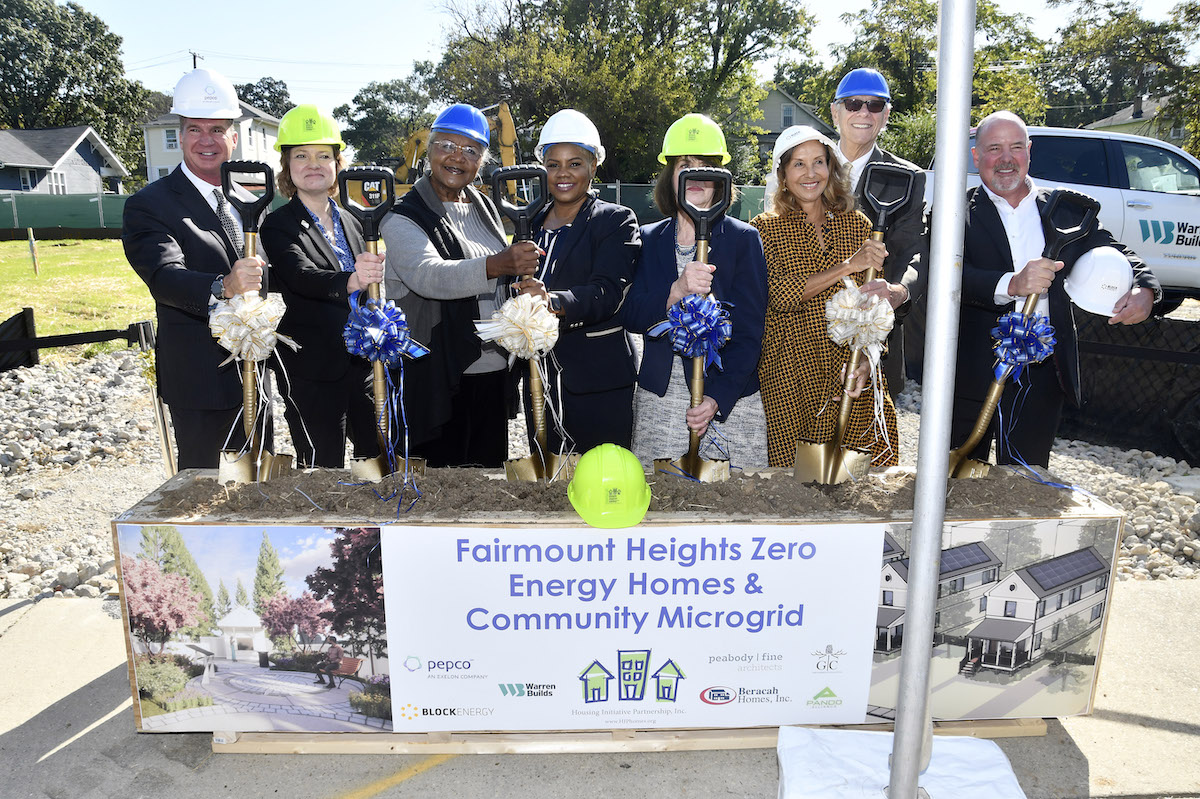 Many stakeholders are involved in the development of six zero-energy homes in Fairmount Heights that will pilot a new microgrid technology. Pictured at the Oct. 13 groundbreaking ceremony, from left: J. Tyler Anthony, Pepco president & CEO; Stephanie Prange Prostel, Housing Initiative Partners deputy director; Md. state senator Joanne C. Benson; Akiaba Stewart, mayor of Fairmount Heights; Maryann Dillon, executive director of Housing Initiative Partnership; Jolene Ivey, Prince George’s County councilmember; Paul Pinsky, director of Maryland Energy Administration; and Rob Bennett, BlockEnergy CEO. (Robert R. Roberts/The Washington Informer)