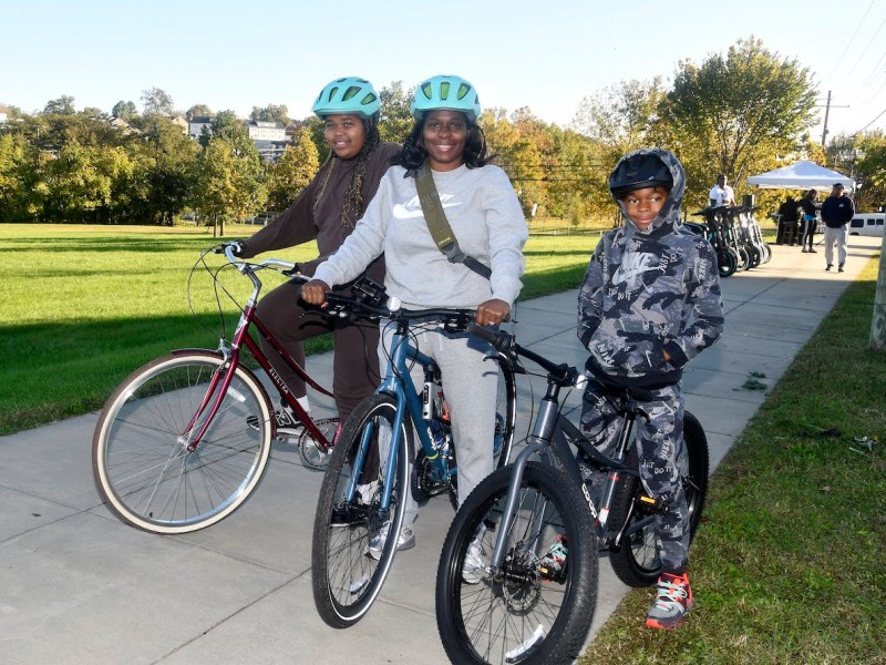 Aloa Smith, 11, Delia House-Smith, and Nigel Smith, 10, take part in the Fresh Wind Community Development Corporation Ward 8 Bike Ride on Oct. 21. (Robert R. Roberts/The Washington Informer)