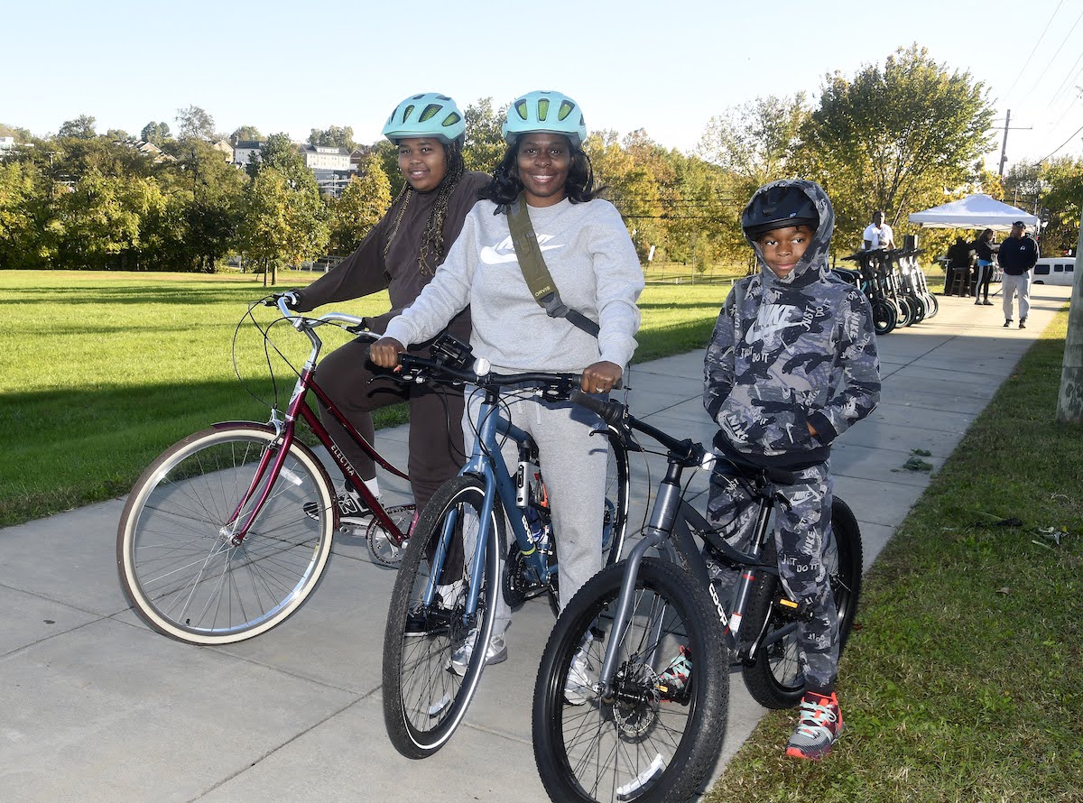 Aloa Smith, 11, Delia House-Smith, and Nigel Smith, 10, take part in the Fresh Wind Community Development Corporation Ward 8 Bike Ride on Oct. 21. (Robert R. Roberts/The Washington Informer)