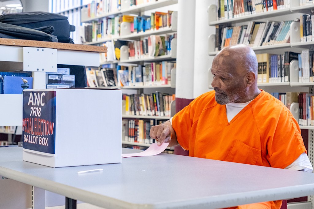 Incarcerated citizen Timothy Farrow casts his ballot during the Advisory Neighborhood Commissioner (ANC) election. (Ja'Mon Jackson/The Washington Informer)