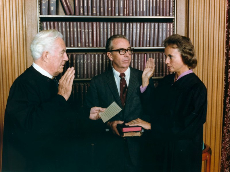 Sandra Day O'Connor is sworn in as a Supreme Court justice by Chief Justice Warren Burger as her husband John O'Connor watches on Sept. 25, 1981. (National Archives and Records Administration via Wikimedia Commons)