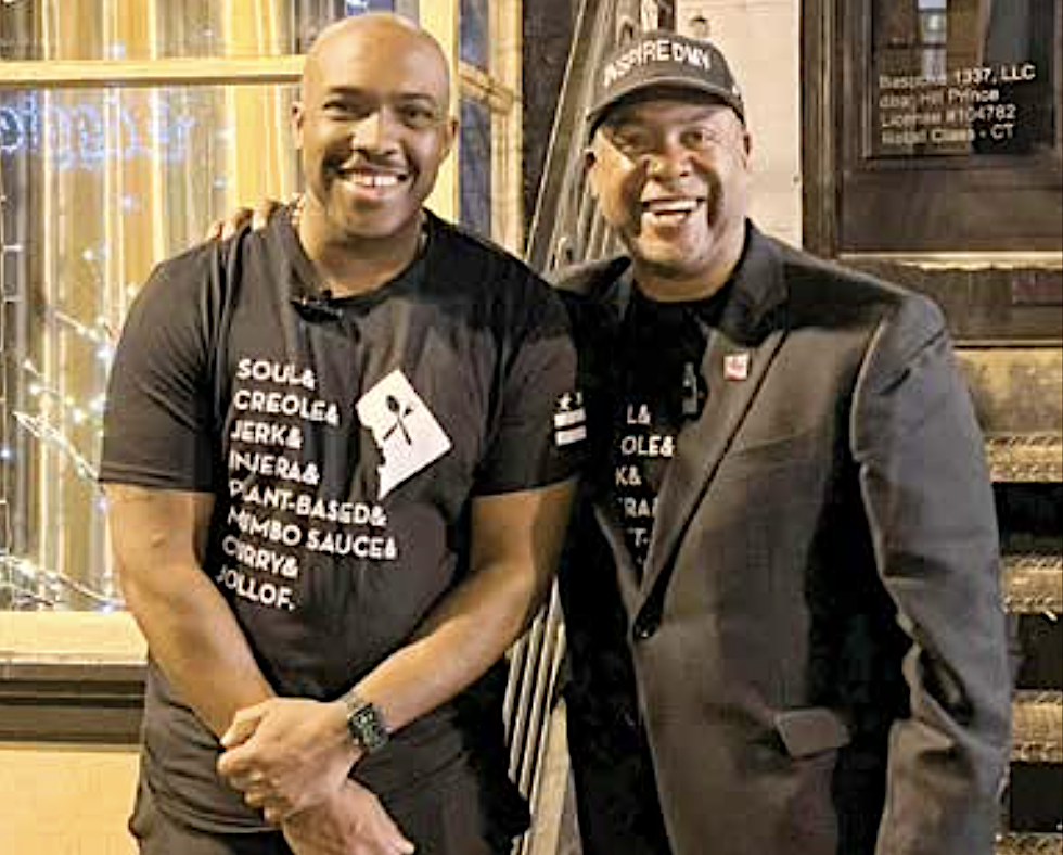 Chef Rock Harper and Chef Furard K. Tate pose in front of Hill Prince. (Ra-Jah Kelly/ The Washington Informer)
