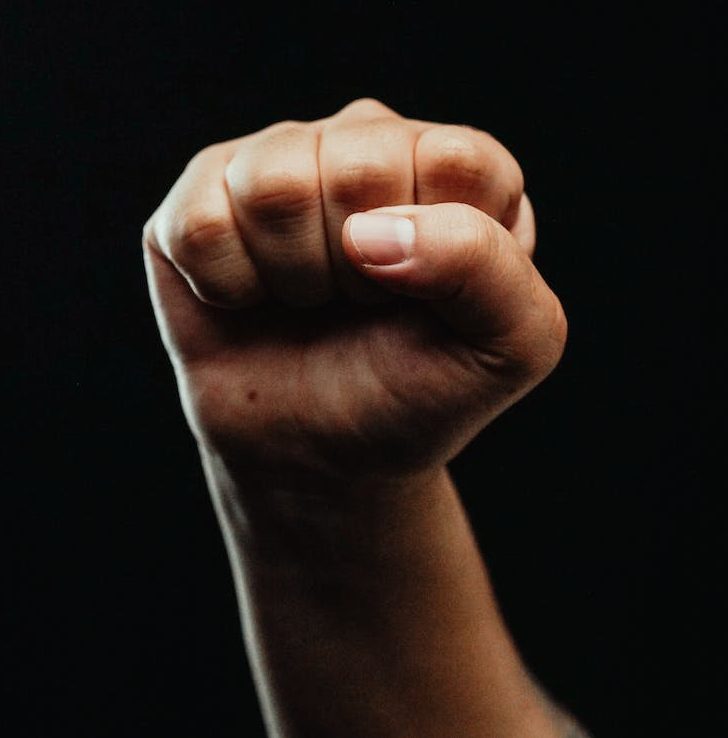 close up photo of a person clenching his fist