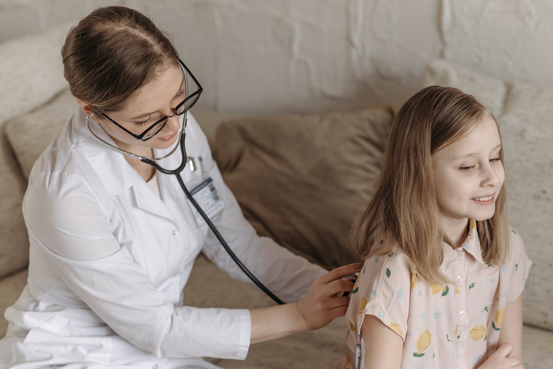 a doctor checking a child