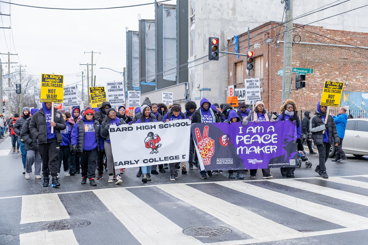 Participants in the annual Martin Luther King Jr. Peace Walk and Parade march down Martin Luther King Jr. Avenue in Southeast D.C. on Jan. 15. (Ja'Mon Jackson/The Washington Informer)