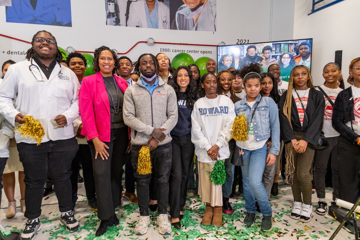 D.C. Mayor Muriel Bowser and students pose for the kickoff of the application season for the 2024 Marion Barry Summer Youth Employment Program. (Ja’Mon Jackson/The Washington Informer)