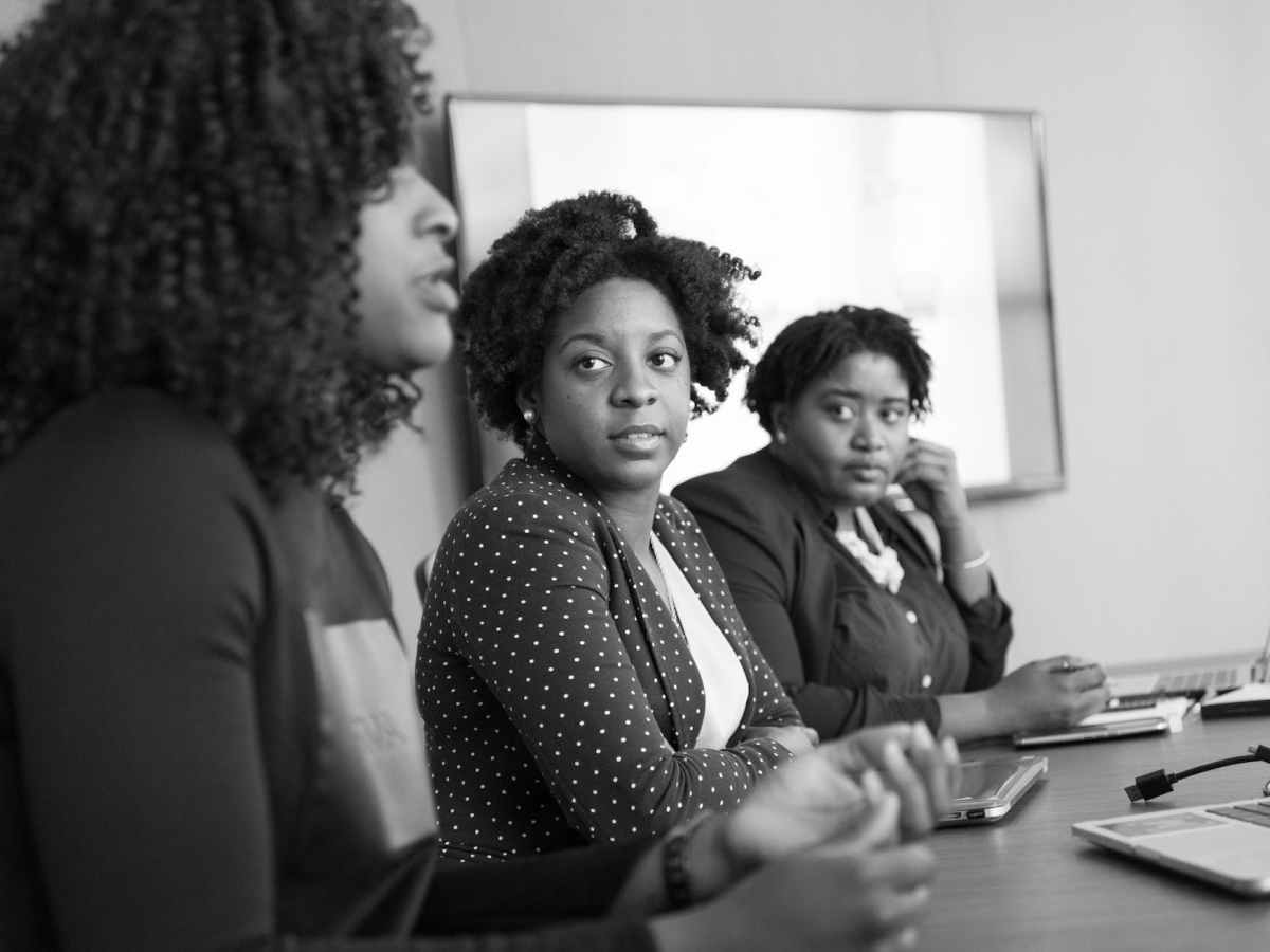 woman discussing with her colleagues