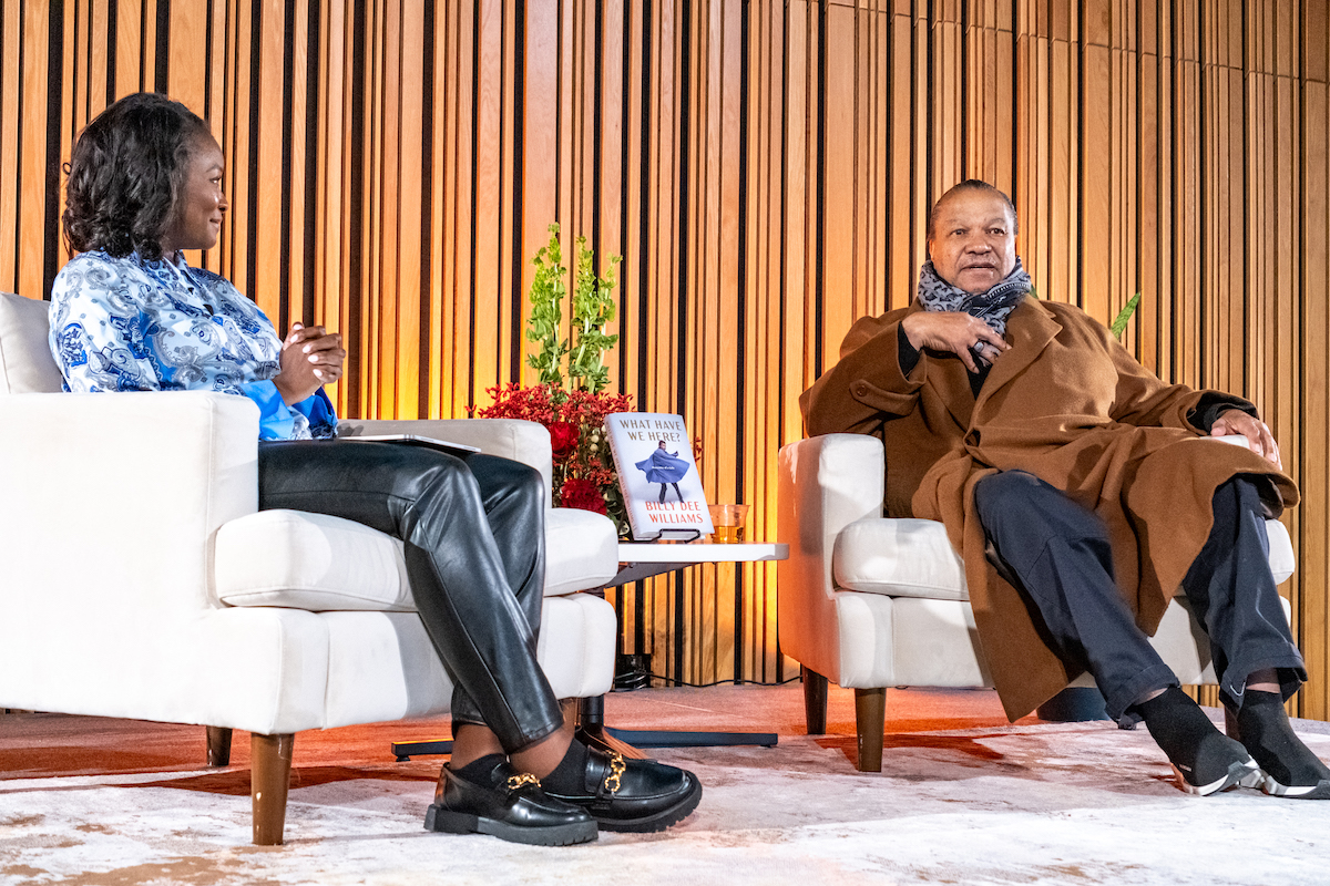 NBC Washington Anchor Jummy Olabanji (left) interviews Billy Dee Williams for the release of his autobiography "What Have We Here?: Portraits of a Life" at the MLK Jr. Library in D.C. on Feb. 15. (Ja’Mon Jackson/The Washington Informer)