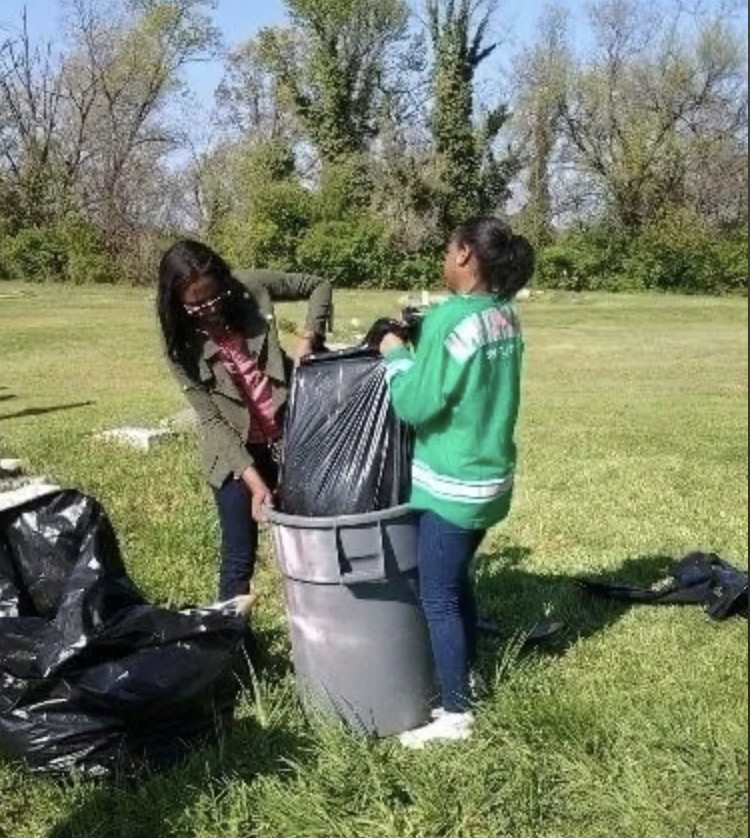 Members of Alpha Kappa Alpha are some of the volunteers who have pitched in to help maintain Woodlawn Cemetery. (Courtesy photo)