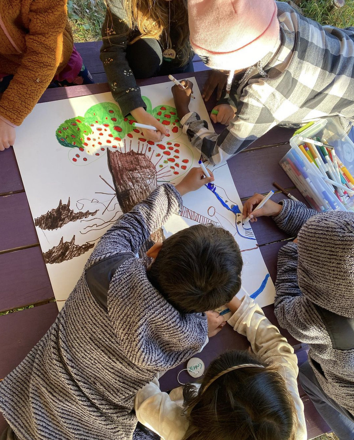 Children engage in arts and crafts activities during outdoor lessons. (Courtesy photo)