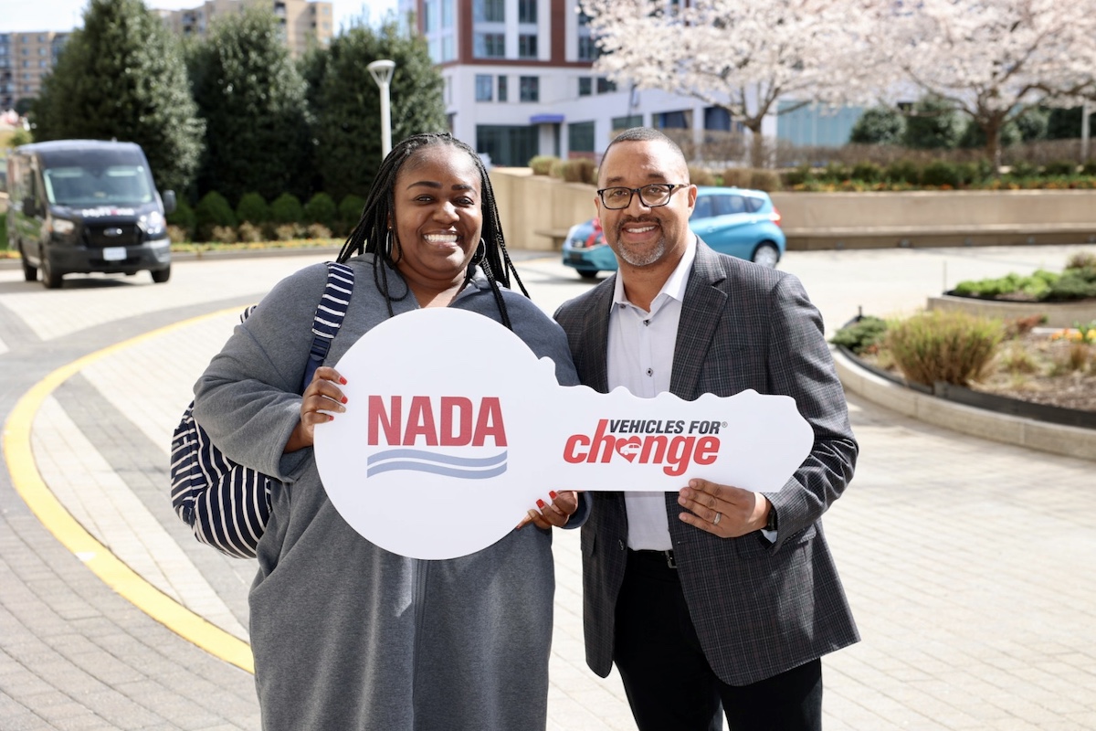 Toni Brown (left) received a Nissan Versa from Damon Lester, Nissan of Bowie.