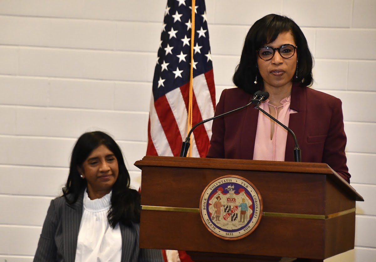 Prince George’s County Executive Angela Alsobrooks (D) speaks at a press conference in Riverdale to support the ENOUGH Act, with Maryland Lt. Gov. Aruna Miller (D) seated behind her. (Robert R. Roberts/The Washington Informer)