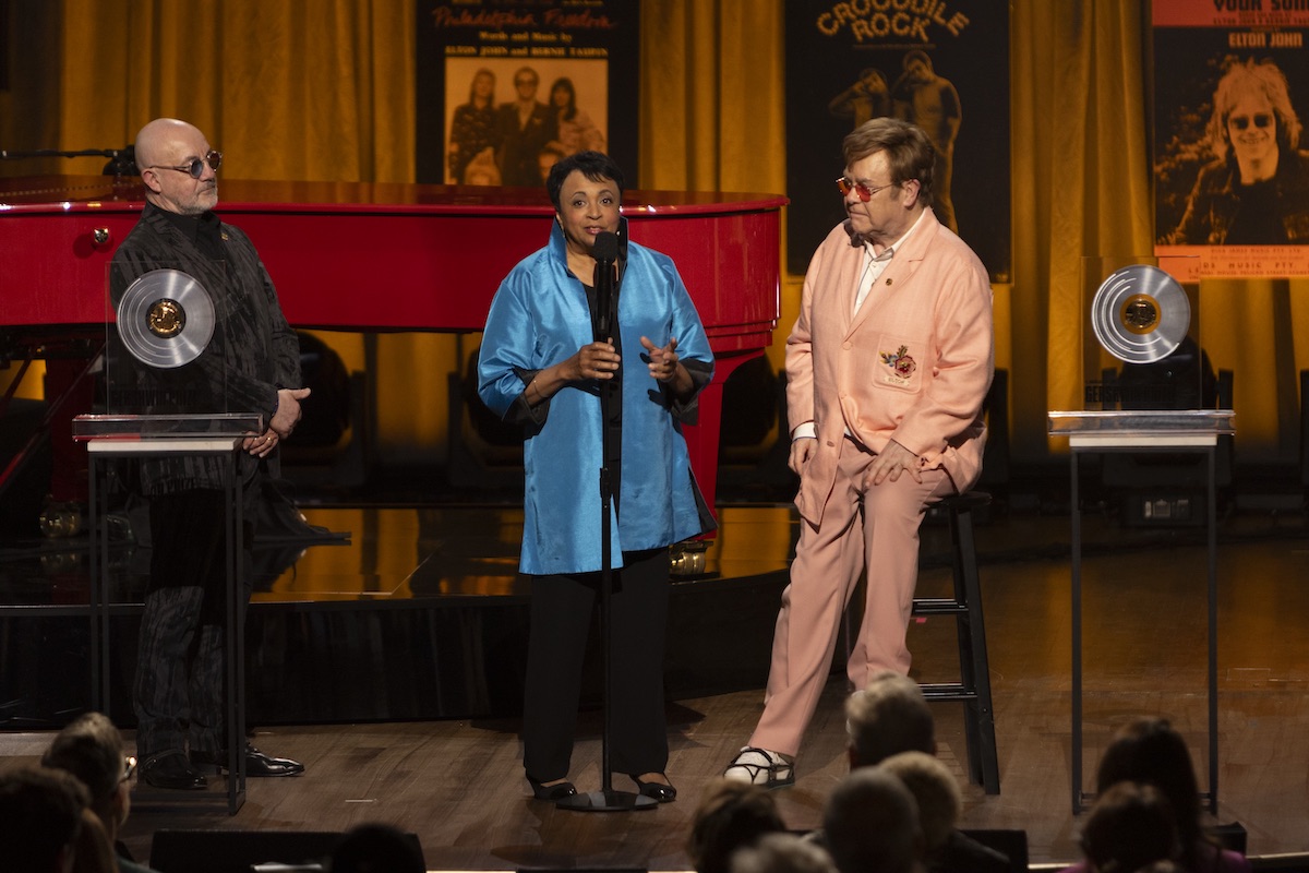 The 2024 Library of Congress Gershwin Prize for Popular Song was recently given to Elton John and Bernie Taupin during a tribute concert held at D.A.R. Constitution Hall. On stage for the ceremony are (from left) Taupin, Librarian of Congress Dr. Carla Hayden, and John. The concert airs on April 8 on PBS. (Courtesy of Library of Congress)