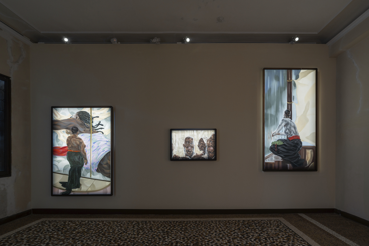 This image captures an exhibition of artworks by Toyin Ojih Odutola. On the left is “Nwanyeruwa (Aba Women’s Rebellion), 2023-2024,” the center is titled “Congregation, 2023,” and on the right is “Onye ututu (Morning Person), 2023.” These pieces seem to explore themes of cultural identity, history, and personal narrative, employing a rich, detailed style.(Courtesy of the Museum of West African Art)