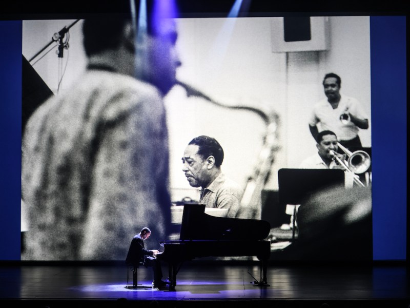 Jason Moran, artistic director for the John F. Kennedy Center for the Performing Arts, plays Duke Ellington compositions against a backdrop of Gordon Parks photos during "Jason Moran — Solo Ellington” at the Kennedy Center on April 10. (Courtesy of the Kennedy Center)
