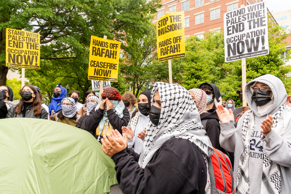 Student activists from around the DMV surround one of the tents at a George Washington University encampment on April 25, calling for a cease-fire in Gaza, where over 34,000 Palestinians have died in Israel's retaliatory response to Hamas terror attacks on Oct. 7. (Ja'Mon Jackson/The Washington Informer)