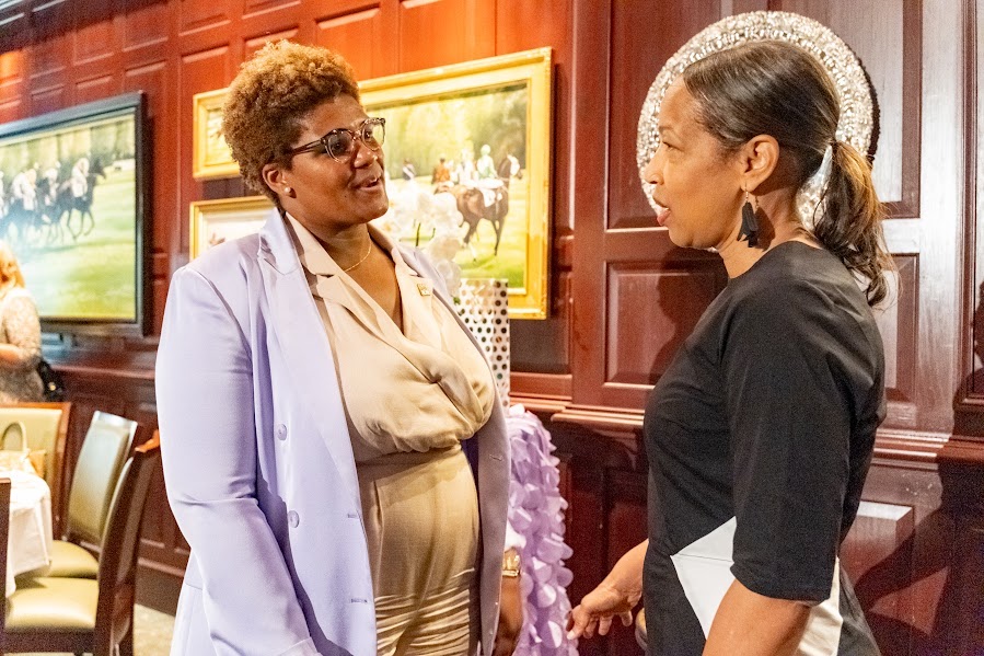 Tiffany Crowe, the director of the D.C. Department of Licensing and Consumer Protection (left) chats with Rosemary Suggs-Evans, the acting director of the D.C. Department of Small and Local Business Development at the Business in Women’s Luncheon on May 21. (Ja’Mon Jackson/The Washington Informer)
