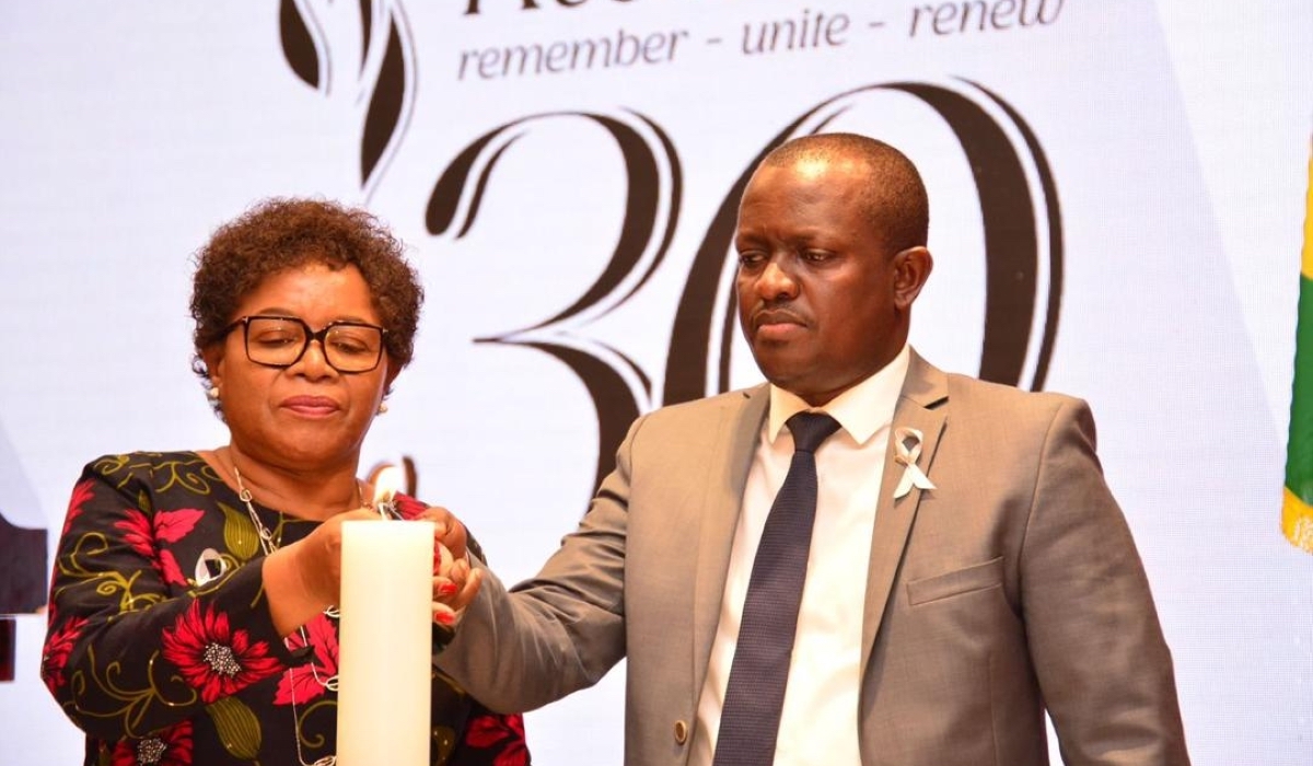 Malawi's Minister of Foreign Affairs Nancy Tembo and Douglas Gakumba, Chargé d'Affaires of Rwanda's embassy in Malawi light a flame of hope in honour of victims of the Genocide. (Courtesy photo)