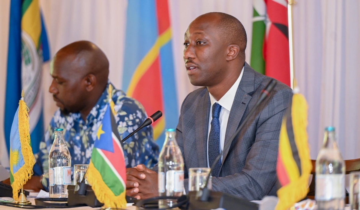 Minister of Infrastructure Jimmy Gasore speaks during the signing ceremony as Kipchumba Murkomen, Kenya’s cabinet secretary for Roads and Transport takes notes. (Courtesy photo)
