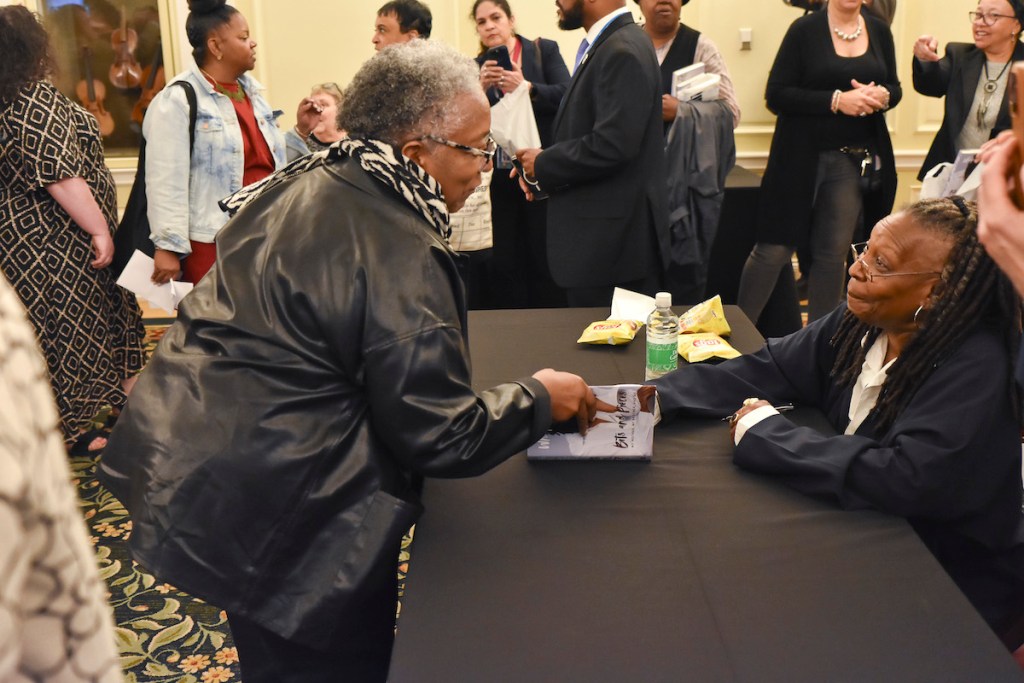 Fans wait in line for an autograph after author, comedian, actress, talk show host, and producer Whoopi Goldberg shared insights from her life during a presentation about her autobiography “Bits and Pieces: My Mother, My Brother, and Me” at the Library of Congress on May 10. (Jacques Benovil/The Washington Informer)