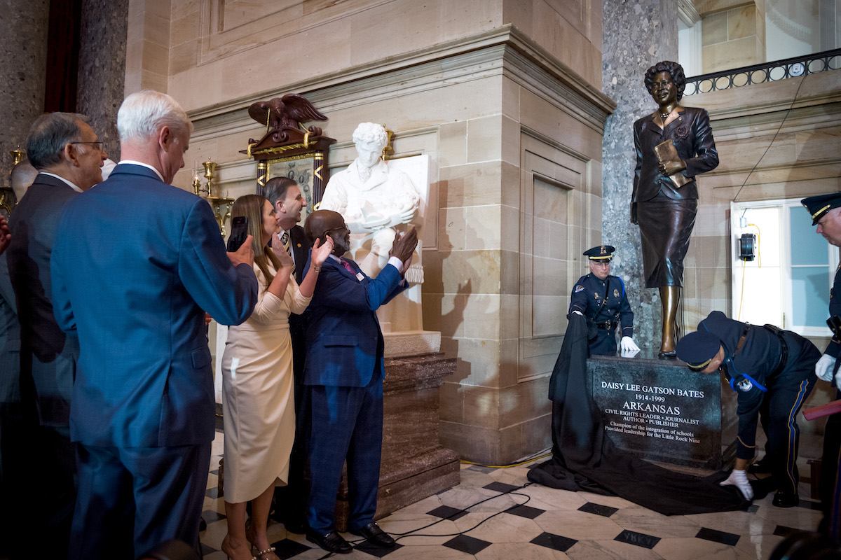 Arkansas Gov. Sarah Huckabee Sanders and President of the Daisy Bates Foundation Charles King and other leaders clap as the Daisy Bates statue is unveiled in the U.S. Capitol’s National Statuary Hall on May 8. (Shedrick Pelt @sdotpdotmedia/The Washington Informer)