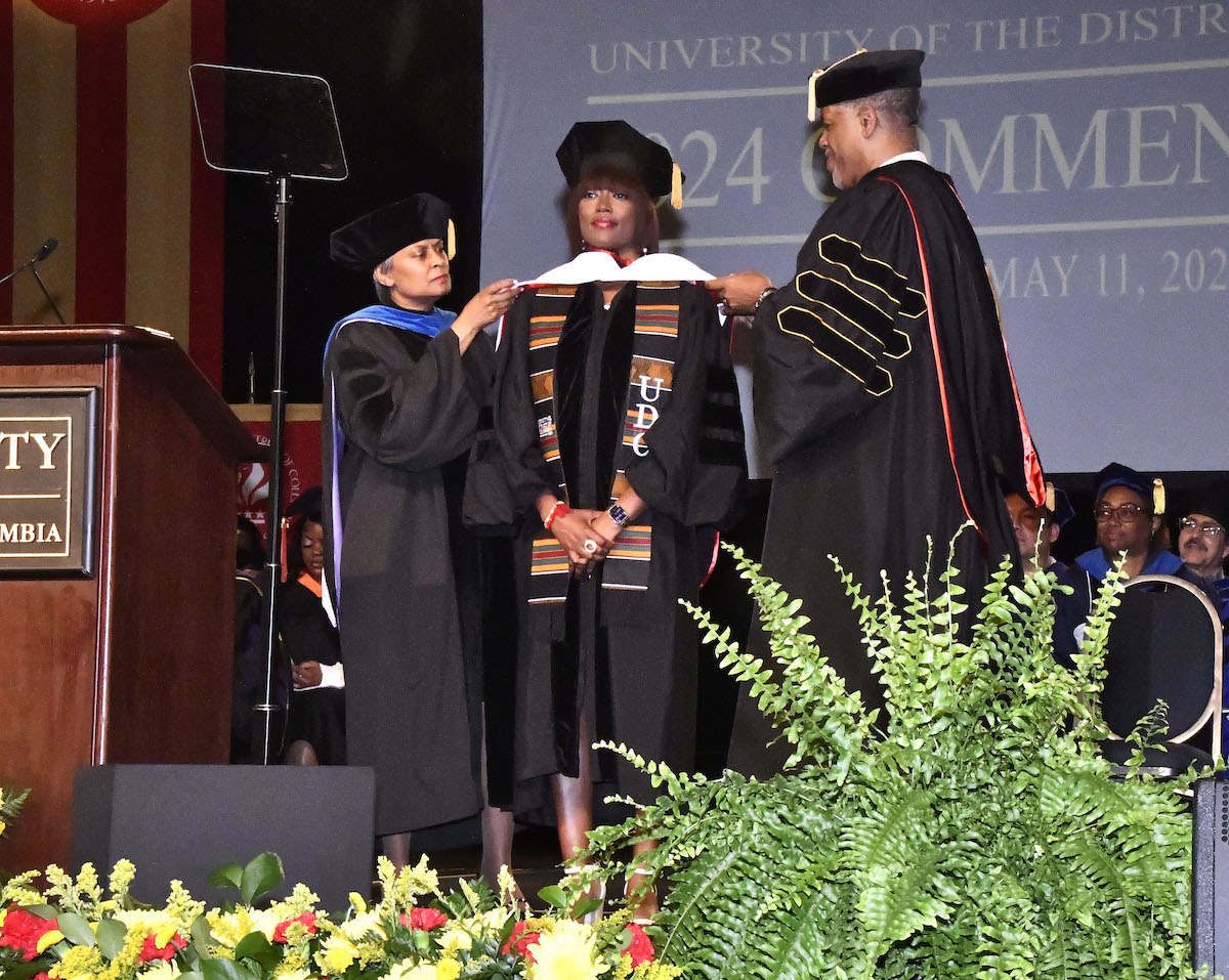 Rashida Jones, who served as UDC's 2024 keynote speaker, receives an honorary doctorate during the ceremony on May 11. (Robert R. Roberts/The Washington Informer)