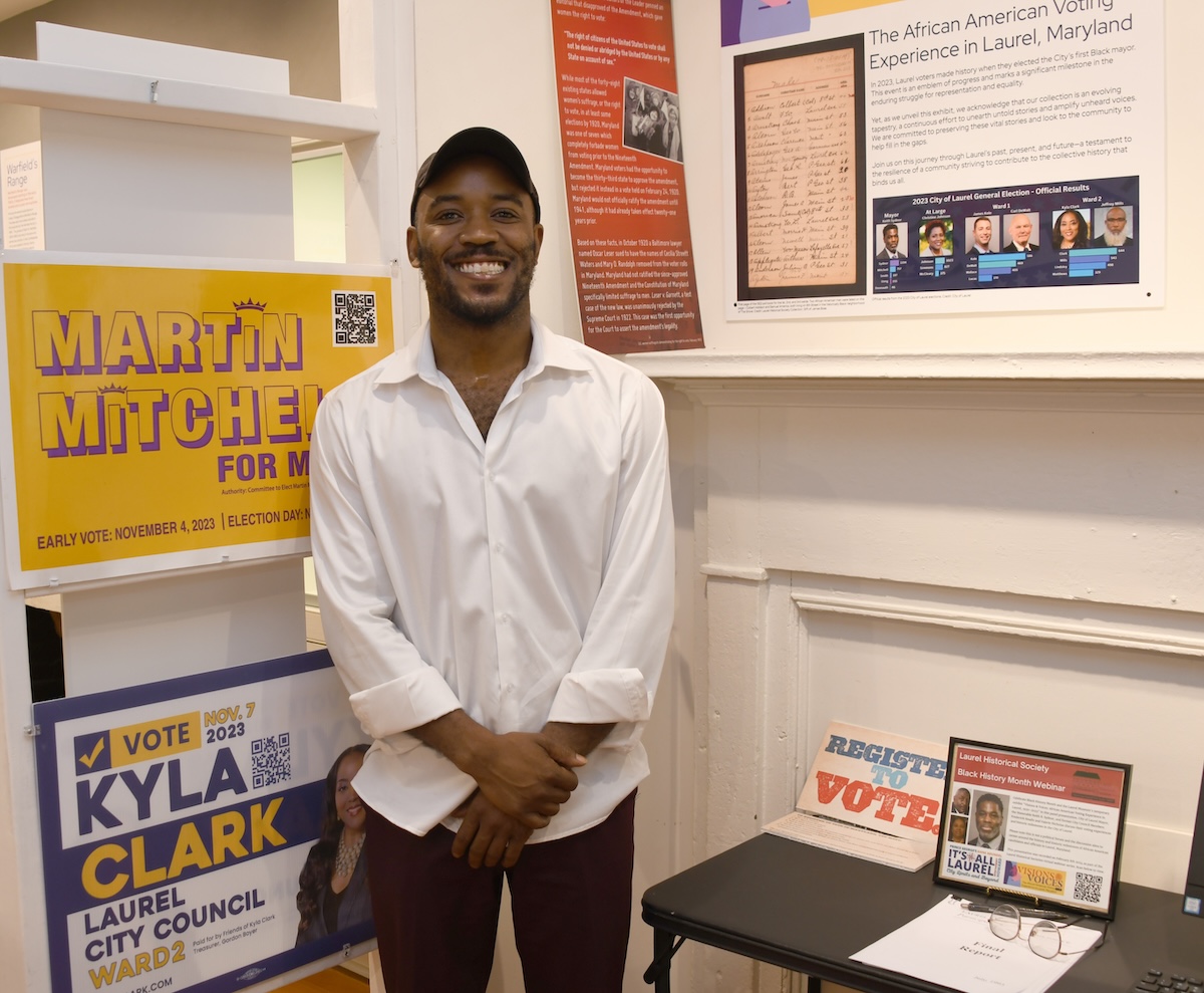 Martin Mitchell, former at-large Laurel Council member, stands in front of his mayoral campaign sign. He ran for mayor in 2023 and was unsuccessful. The Laurel Museum’s newest temporary exhibit, "Visions and Voices 1920-2023, the African American Voting Experience," is running from Feb. 16 through June 16. (Anthony Tilghman/The Washington Informer)