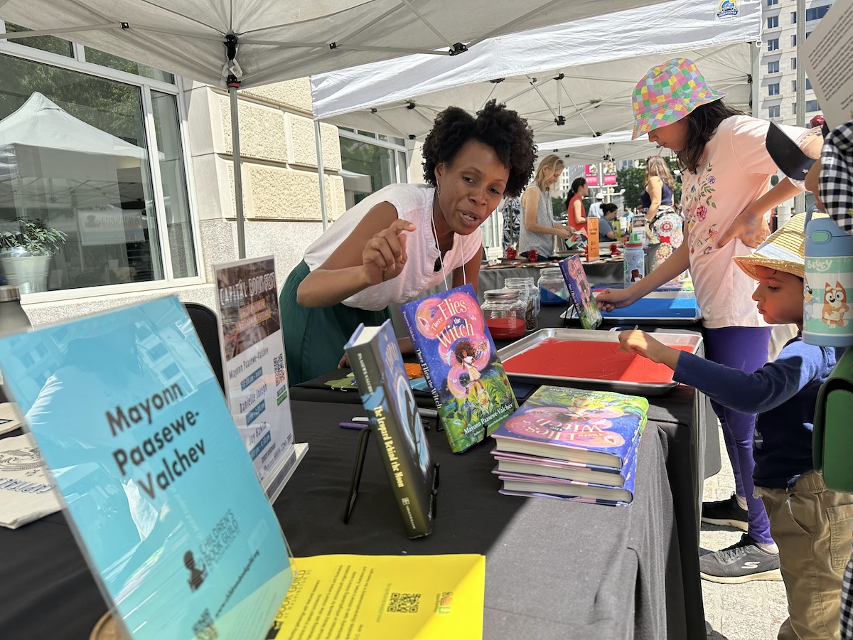 Children's author Mayonn Paawewe-Valchev joined 16 local authors who sold and autographed books at the Capital Book Fest visitors on Saturday, June 15 at the Woodrow Wilson Plaza in D.C. (D.R. Barnes/The Washington Informer)