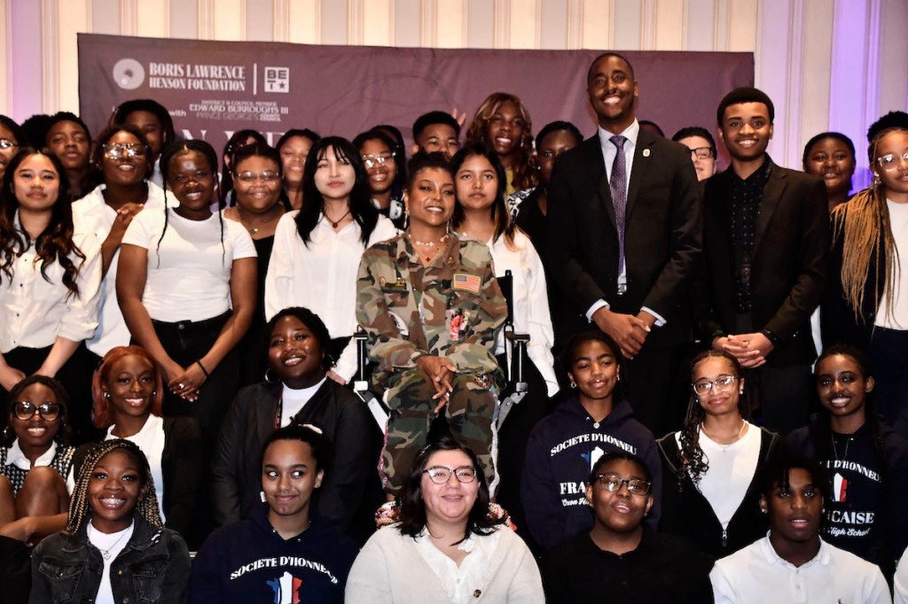 Taraji P. Henson and Council member Edward Burroughs III pose with local students at the Can We Talk? 2024 Symposium on May 31 at the Gaylord National Harbor. (Robert R. Roberts/The Washington Informer)