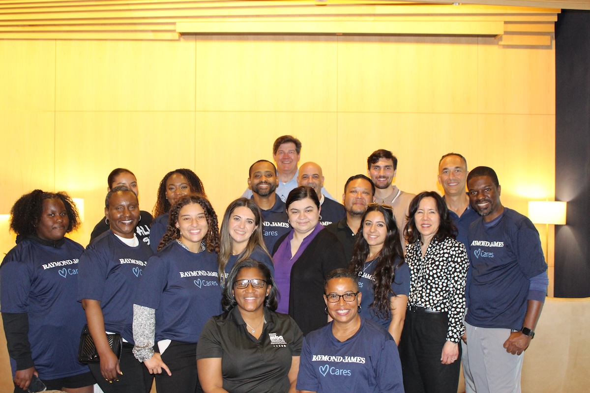 Raymond James employees, DC Black MBA members and partnering schools gather for a photo. (DC Black MBA)